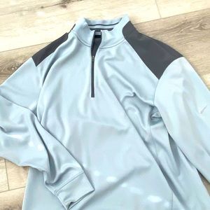 This is a Nike golf sweater